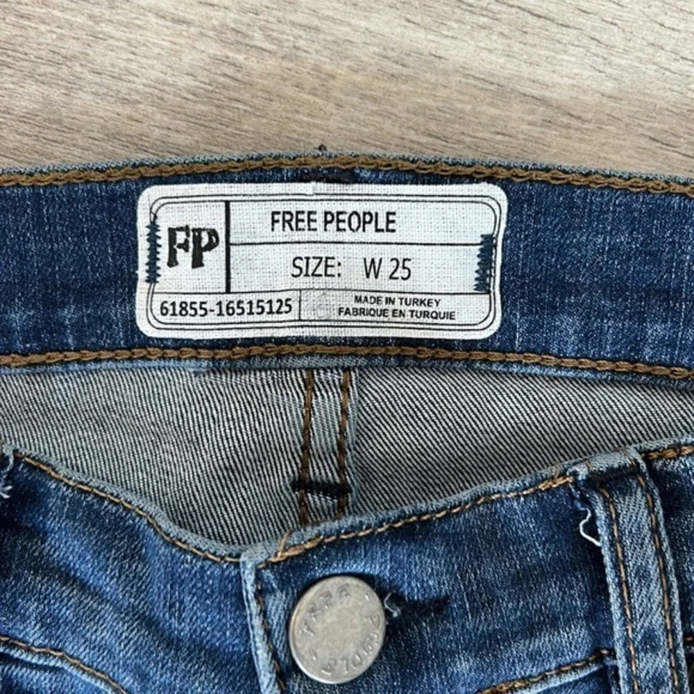 Free People size 25 busted knee button fly jeans